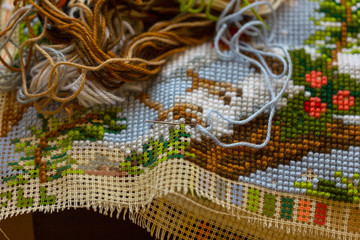 Cross-stitch handle is very colorful and tasteful