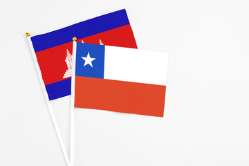 Chile and Cambodia stick flags on white background. High quality fabric, miniature national flag....