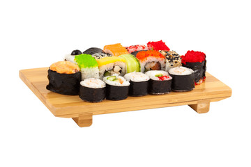 Set of sushi on wooden boadr isolated on white background