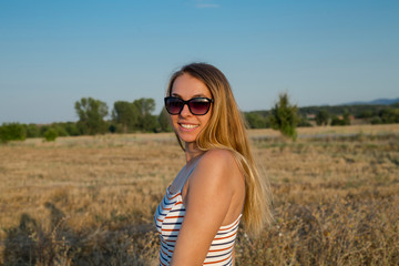 woman in the fields on sunset. Travel concept