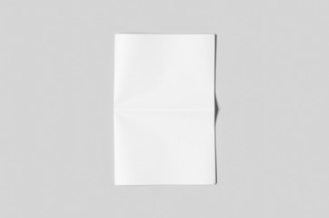 Blank newspaper mockup on a grey backgound.