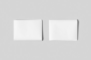 Blank newspaper mockup on a grey backgound.