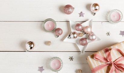 Preparation christmas gifts on a white wooden table with pink decorations