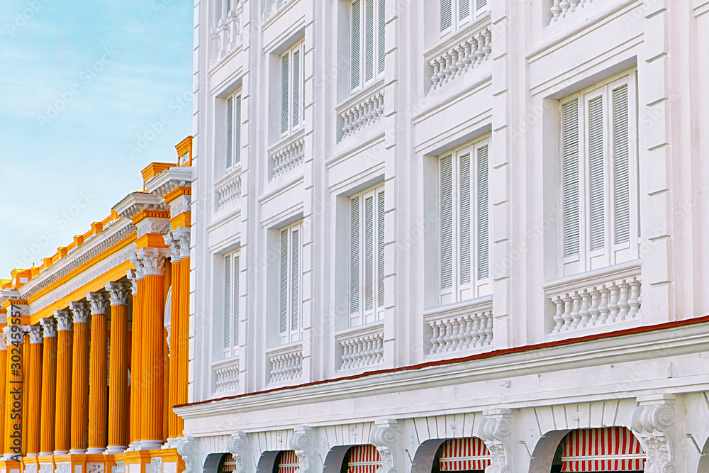 Wall mural white building next to orange building, santiago de cuba - cuba