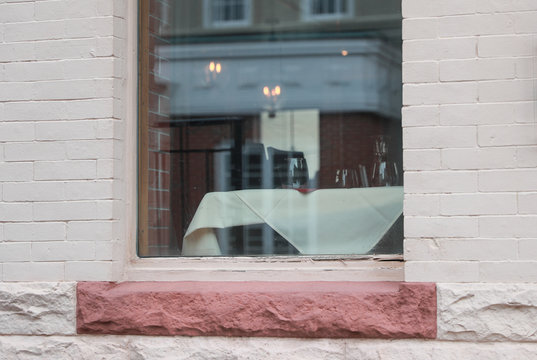 Empty wine glass And Table At Cafe Seen Through Glass Window - Image