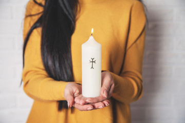 woman hand holding candle