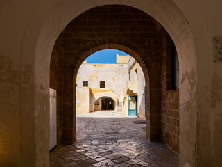 Arch in picturesque old town of Gallipoli, a beautiful travel destination in Puglia, Italy
