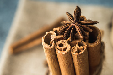 cinnamon sticks and star anise on wooden background
