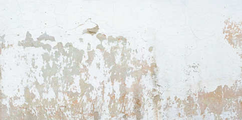old white wall with crumbling plaster