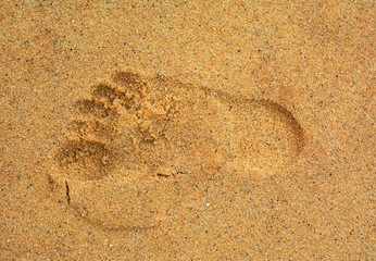 a trace of a man's foot on the sand