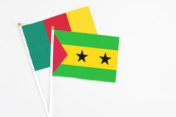 Sao Tome And Principe and Cameroon stick flags on white background. High quality fabric, miniature...