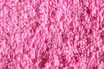 Blurred image of a pink fabric texture.  Abstract textile background. Pink color background, space for text. 