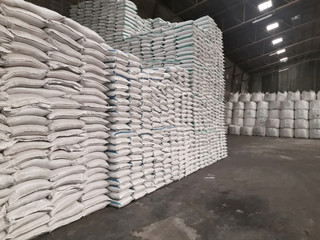The product stock Chemical fertilizer is packed in sacks, stacked in the warehouse, waiting for delivery.