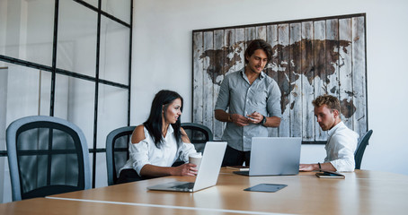 Young business people in formal clothes working in the office