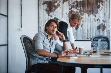 Fototapeta premium Young business people in formal clothes working in the office