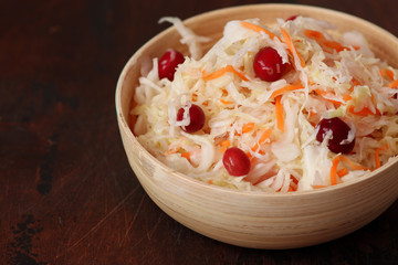 Homemade Traditional sauerkraut with carrots and cranberries