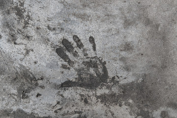 Handprint on cement. Memorable handprint of a hand in an old concrete wall.  Copy space for text.