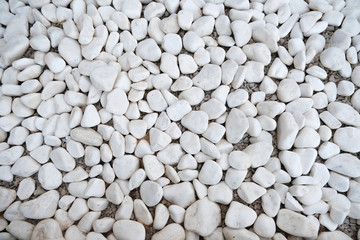 White pebbles background. The texture of the stones.