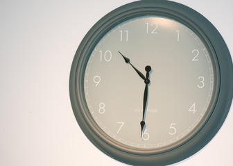 Big olive green wall clock with New York lettering on it