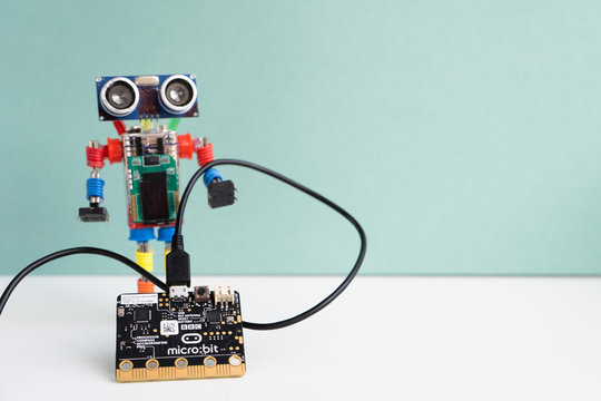 Minsk, Belarus. October, 2019. The BBC robot Micro Bit is near the robot. It can be programming on Scratch and Python. Creative. Connected. Coding. Learning, teaching easy and fun. Free space for text
