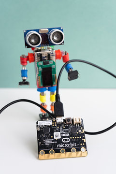 Minsk, Belarus. October, 2019. The BBC robot Micro Bit is near the robot. It can be programming on Scratch and Python. Creative. Connected. Coding. Learning, teaching easy and fun. Free space for text