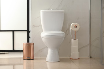 Interior of modern bathroom with toilet bowl