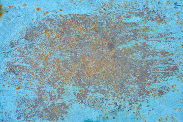 Texture of blue paint and rusty metal, background close-up