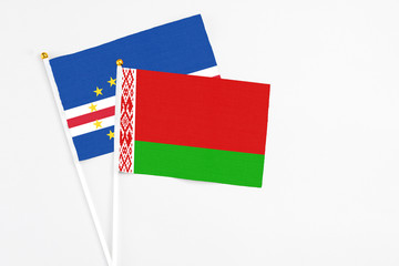 Belarus and Cape Verde stick flags on white background. High quality fabric, miniature national flag. Peaceful global concept.White floor for copy space.