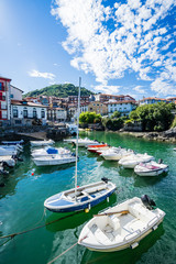 MUNDACA, SPAIN - 12 AUGUST,2017: this town is located in the coast at the mouth of the Urdaibai Ria in the Bay of Biscay - 302477593
