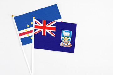 Falkland Islands and Cape Verde stick flags on white background. High quality fabric, miniature...