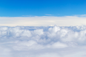 White Fluffy Clouds with Blue Sky Above