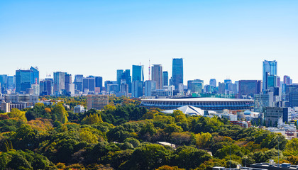Landscape of national stadium for Tokyo Olympic 2020 in the background of blue sky in Japan   - obrazy, fototapety, plakaty