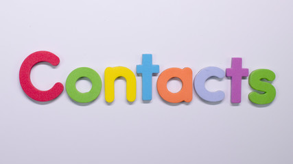 Word "Contacts" written with color sponge