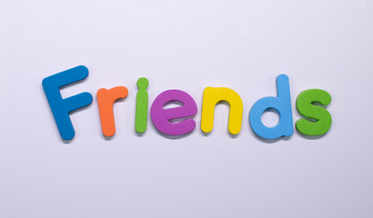 Word "Friends" written with color sponge