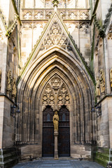 Germany, Beautiful artistic old gothic style entrance door of church building st mary, called marienkirche in downtown reutlingen city at the marketplace