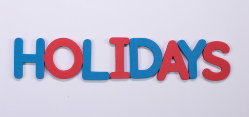 Word Holidays written with color sponge