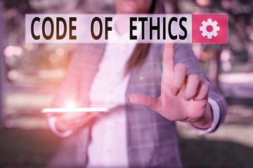 Writing note showing Code Of Ethics. Business concept for Moral Rules Ethical Integrity Honesty...