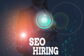 Writing note showing Seo Hiring. Business concept for employing a specialist will develop content to include keywords