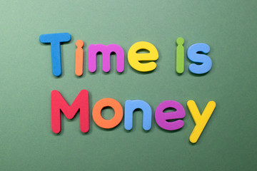 "Time is money" written with color sponge