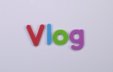 Word Vlog written with color sponge