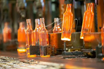 Glassworks. Glass industry. The process of making glass bottles.