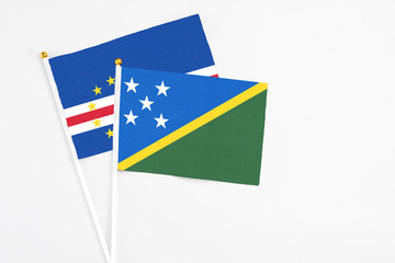 Solomon Islands and Cape Verde stick flags on white background. High quality fabric, miniature...