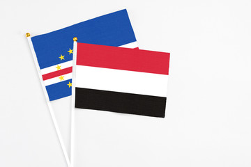 Yemen and Cape Verde stick flags on white background. High quality fabric, miniature national flag. Peaceful global concept.White floor for copy space.