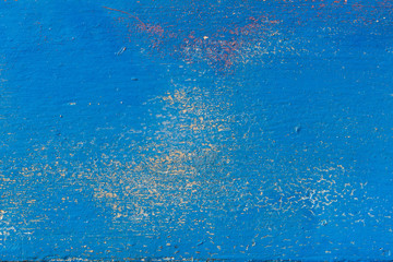 Old surface with peeling paint. Blue grunge background with cracks, scratches, peeling paint
