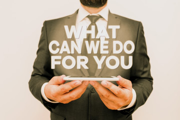Text sign showing What Can We Do For You. Business photo text we are at your Service Willing to help Do a Favor or Male human wear formal work suit hold smart hi tech smartphone use hands