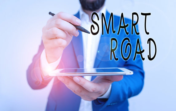 Handwriting text Smart Road. Conceptual photo number of different ways technologies are incorporated into roads Businessman pointing with pen in empty copy space