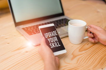 Writing note showing Upgrade Your Skill. Business concept for Expand Scope of Knowledge Optimize Skills Craft woman with laptop smartphone and office supplies technology