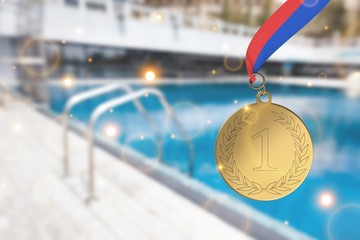 Hand holding golden trophy on blurred background