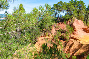 Roussillon, red rocks colorful ochre canyon in Provence