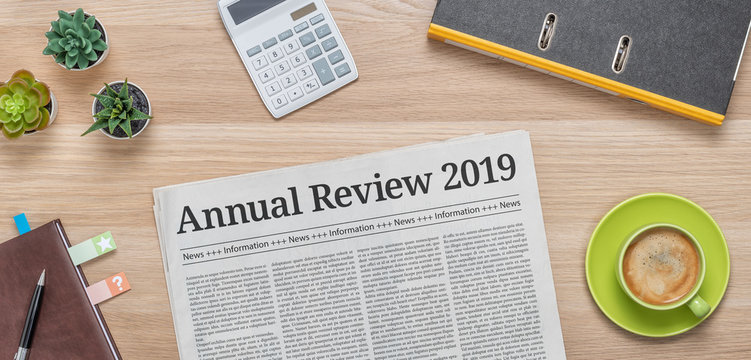 A newspaper on a desk with the headline Annual review 2019